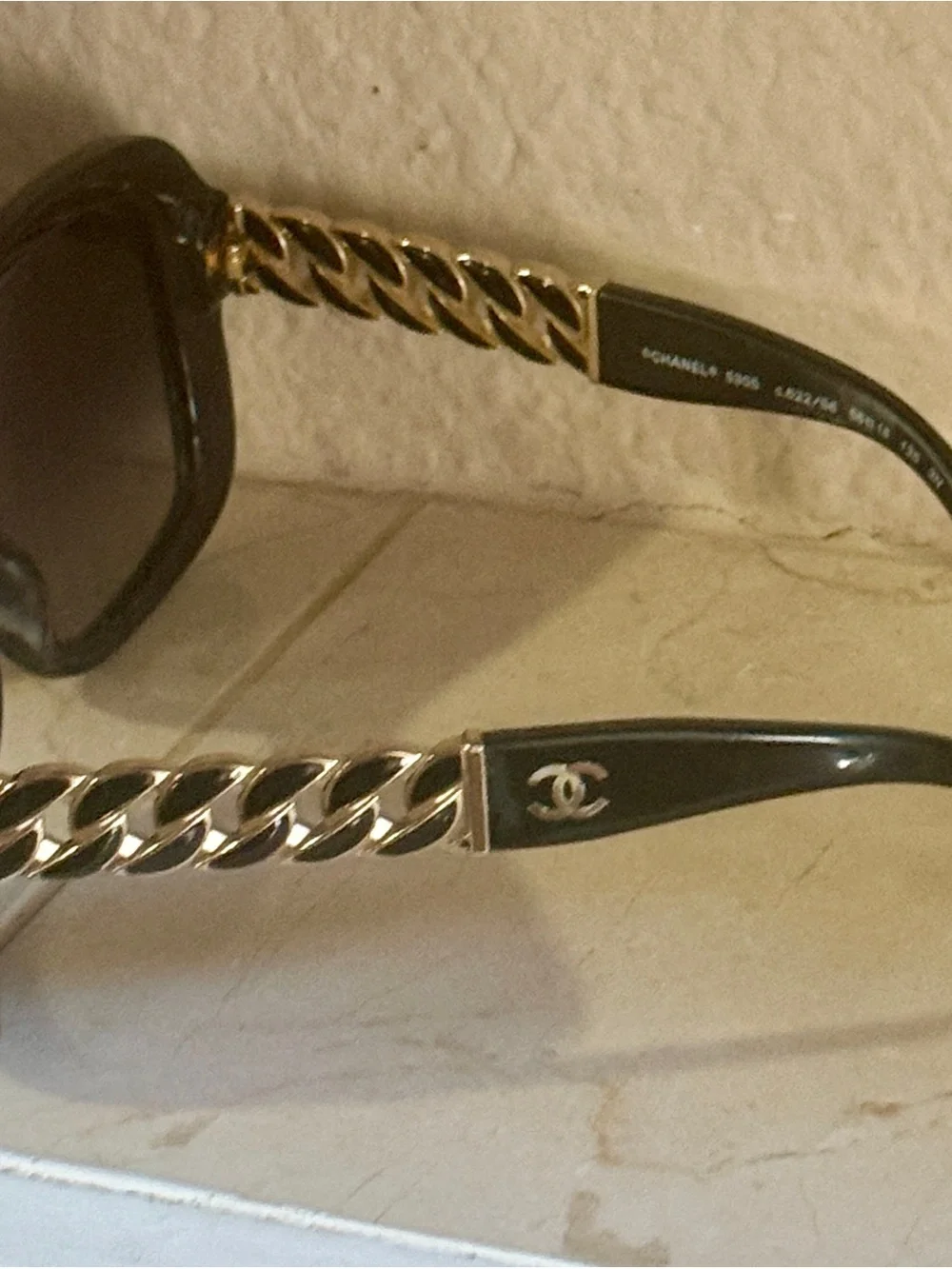 CHANEL Black Sunglasses with Gold Chain Temple Accents